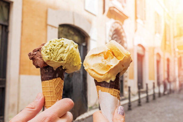 Two,Hands,Close-up,Holding,Cones,With,Italian,Ice-cream,Gelato,On